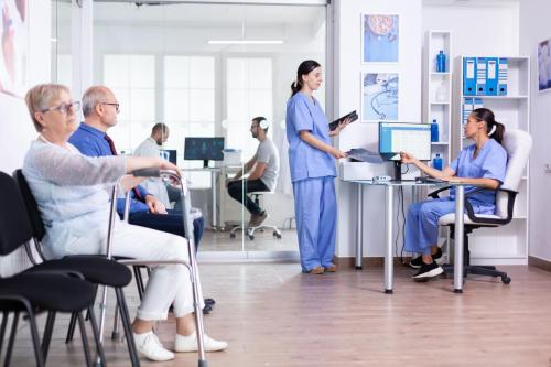 Medical nurses holding patient radiography